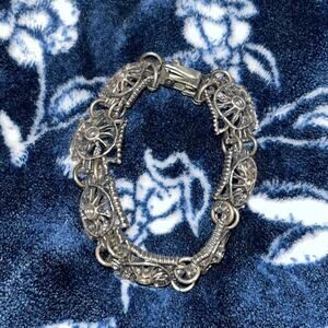 Vintage Link Bracelet featuring square panels with filigree sun designs